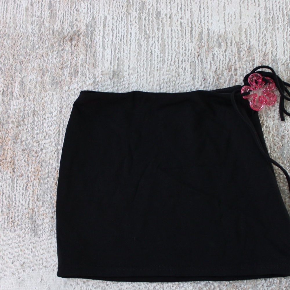Black Skirt with Pink Flower Accent